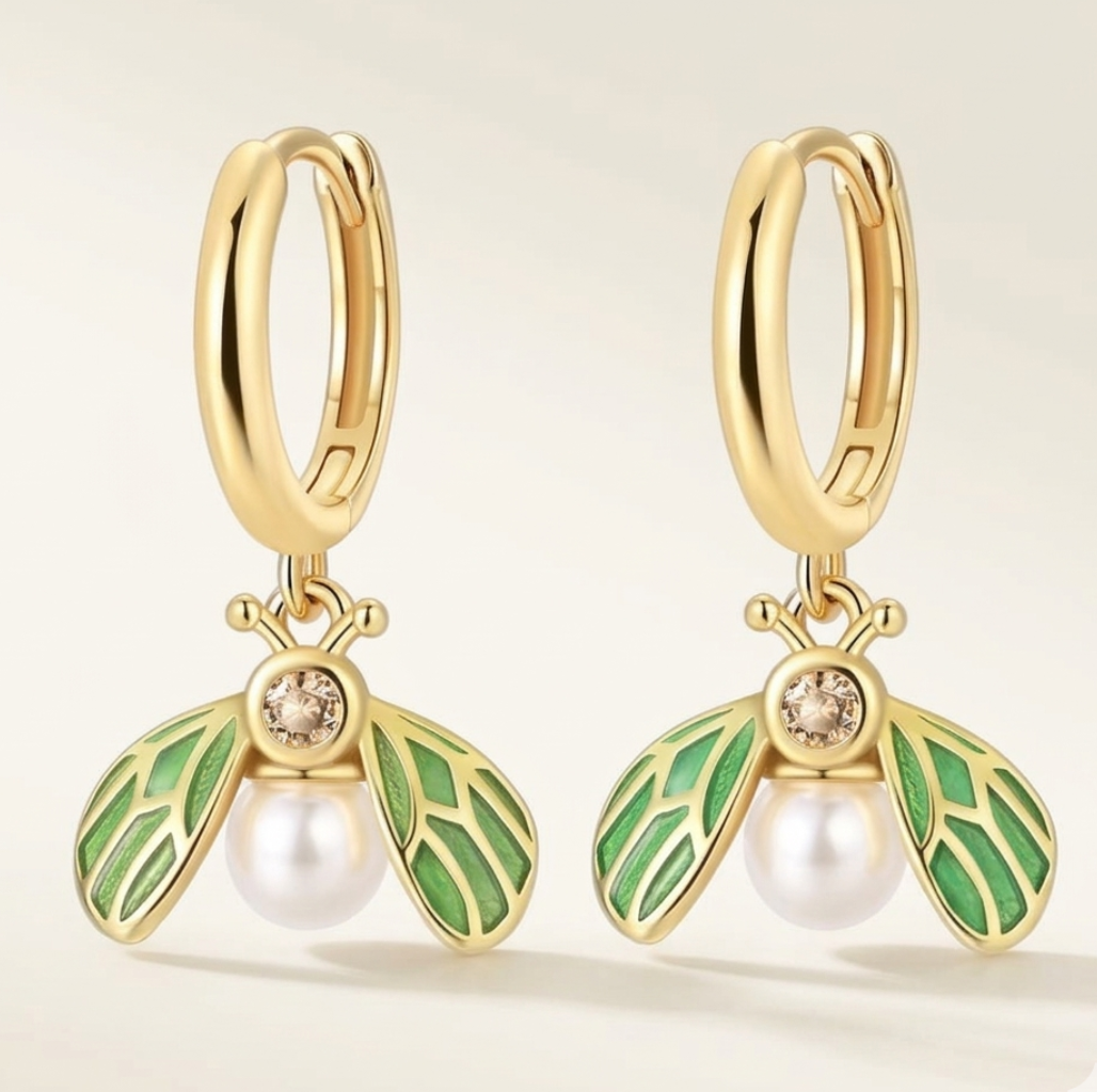 Gold Earrings shaped like dragonflys