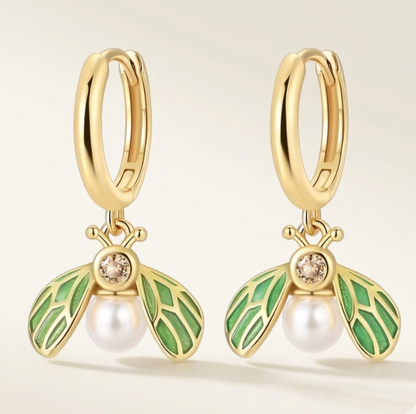 Gold Earrings shaped like dragonflys