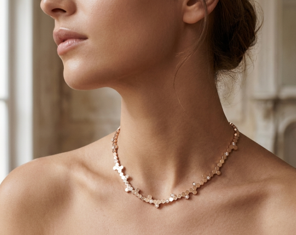 Close-up of a woman wearing the Veruccia Hexagonal Necklace