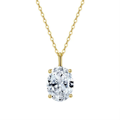 Gold necklace with a oval shaped cubic zirconia pendant on a white background