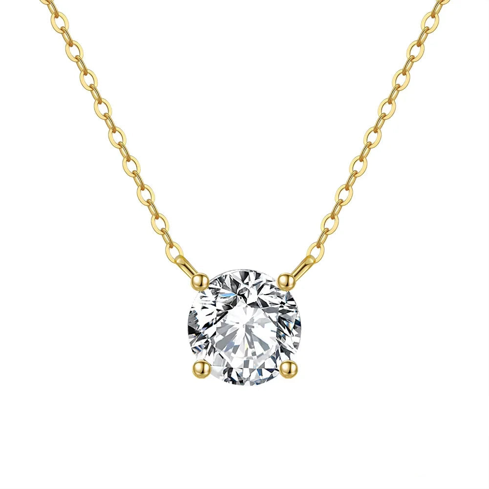 Veruccia Gold necklace with a clear gemstone pendant on a white background