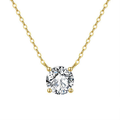 Veruccia Gold necklace with a clear gemstone pendant on a white background