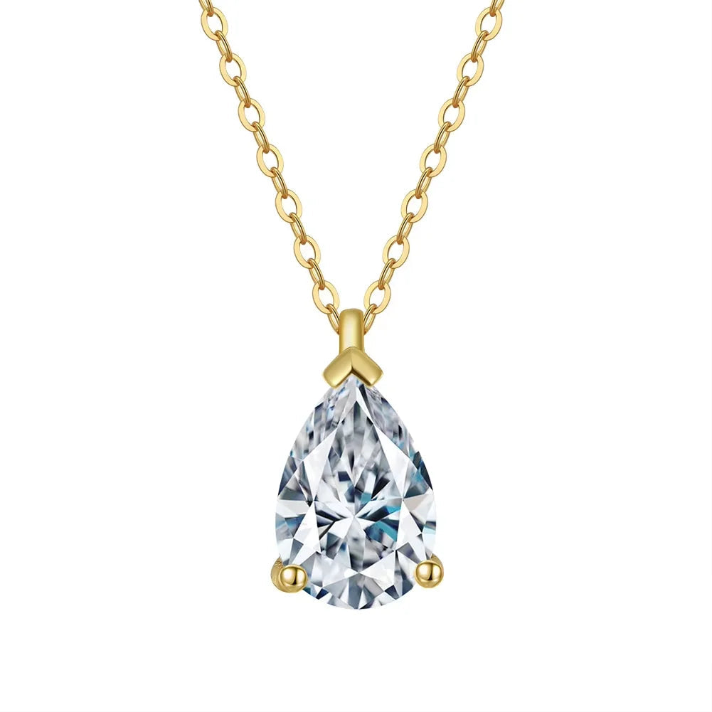 Gold necklace with a teardrop-shaped crystal pendant on a white background
