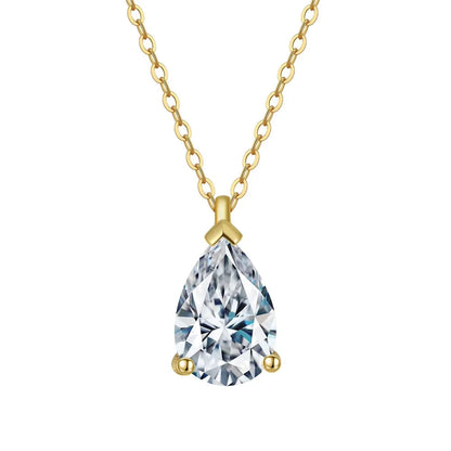 Gold necklace with a teardrop-shaped crystal pendant on a white background