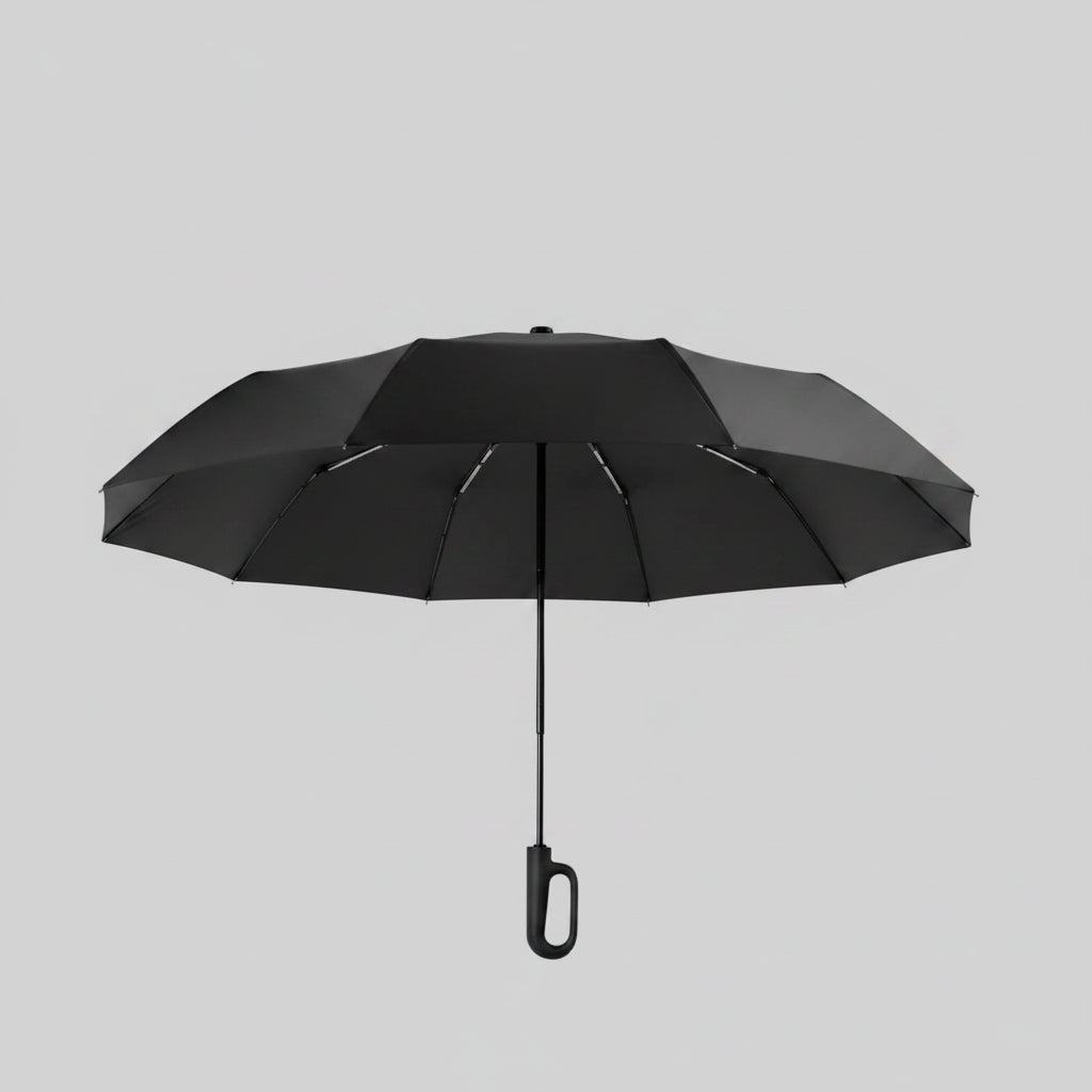 Black umbrella with ring buckle design on a beige background
