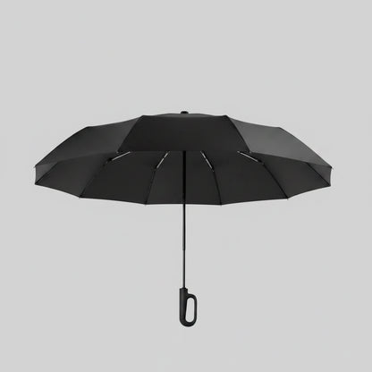 Black umbrella with ring buckle design on a beige background